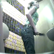 A blonde (most likely Eastern-European) girl is recorded by hidden camera as she takes a shit while sitting on a toilet in a public bathroom. She looks like she is either constipated or having stomach cramps. Pooping sounds are audible.